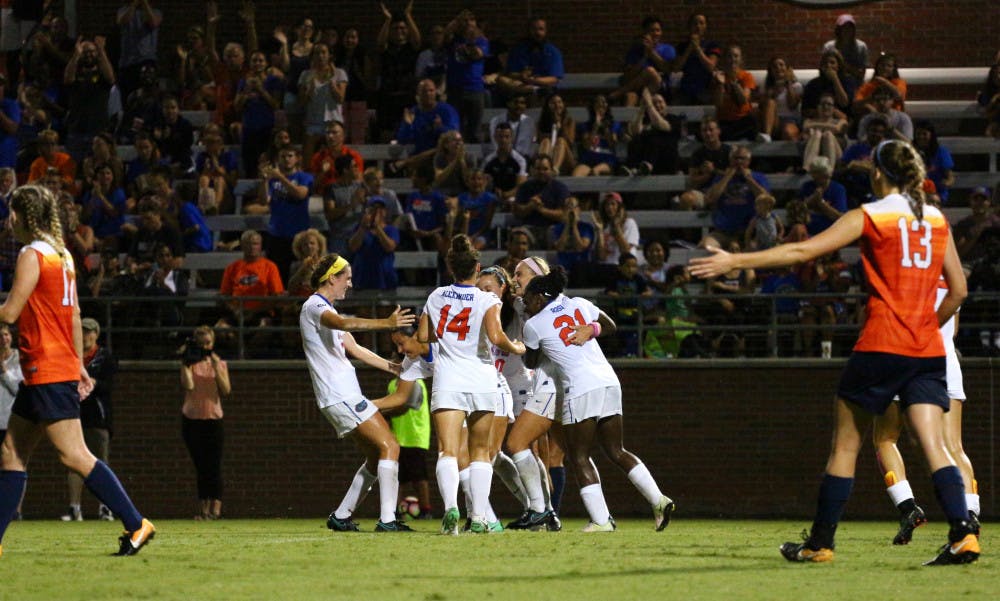 Florida players celebrate during UF's 2-1 win against Syracuse on Sunday at Donald R. Dizney Stadium.