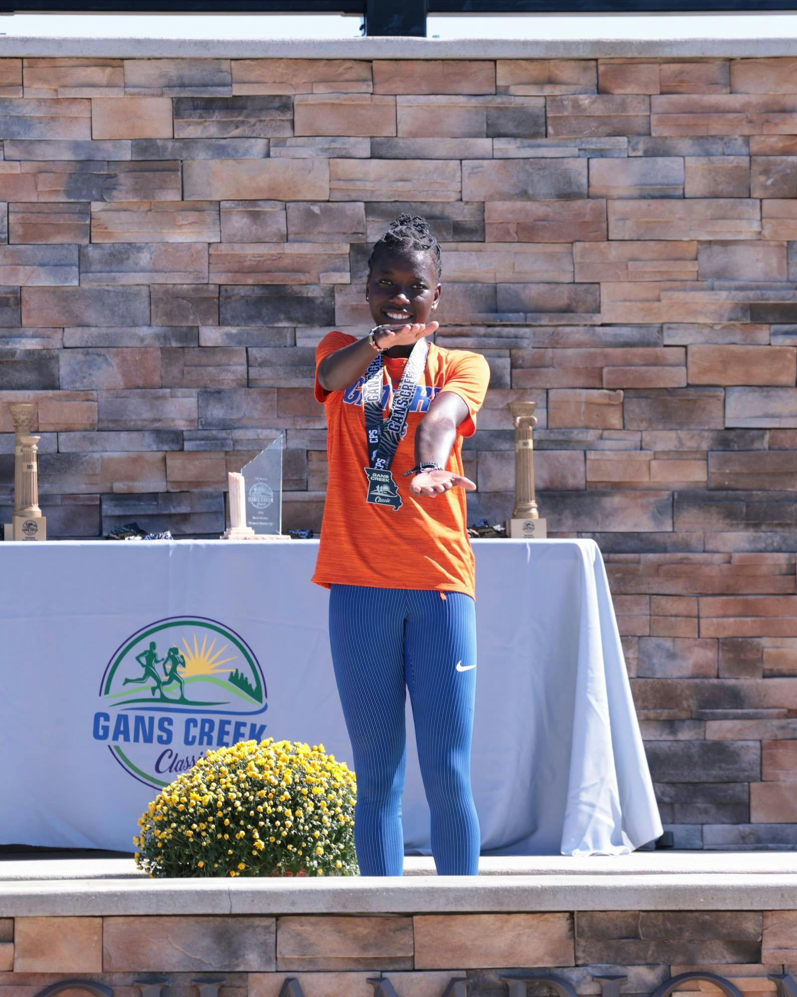 Judy&#x20;Chepkoech&#x20;stands&#x20;on&#x20;a&#x20;podium&#x20;after&#x20;finishing&#x20;seventh&#x20;at&#x20;the&#x20;Gans&#x20;Creek&#x20;Classic&#x20;on&#x20;Friday,&#x20;Sept.&#x20;26,&#x20;in&#x20;Columbia,&#x20;Missouri.&#x20;&#x28;Courtesy&#x20;UAA&#x20;Communications&#x29;