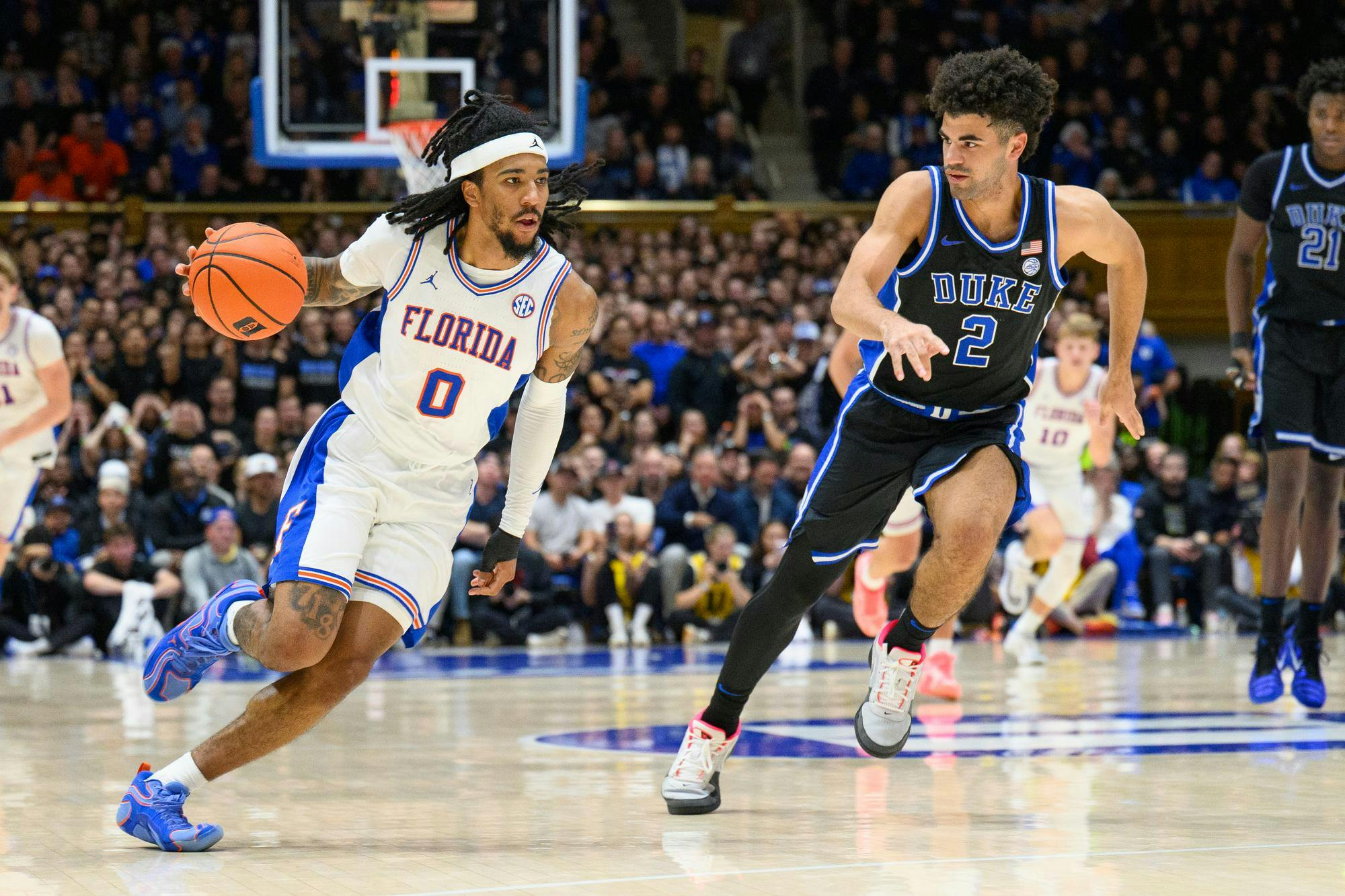 Florida guard Boogie Fland (0) excelled in the final minutes against Duke, scoring the Gators' final four field goals before a costly turnover gave the Blue Devils the win. 