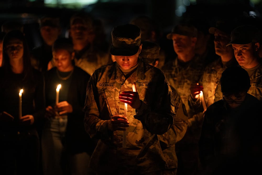 Members of the University of Florida ROTC gather outside the Southwest Recreation Center at the University of Florida for a candlelight vigil in honor of Nyla Holland who died on Sunday, March 2, 2025, while riding her moped on Hull Road in Gainesville, Fla. Holland was a member of University of Florida's ROTC program.