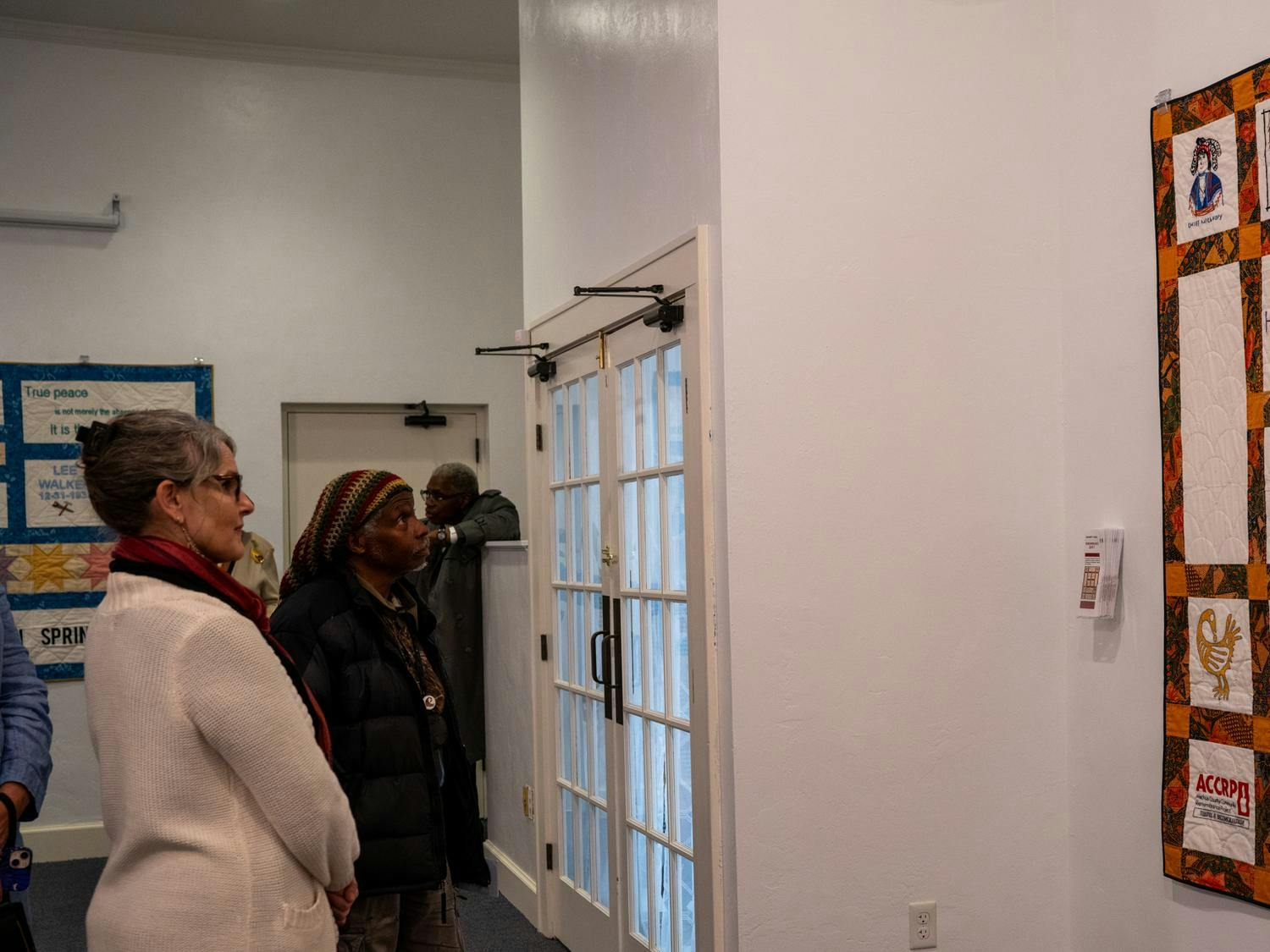 Onlookers view the lynch remembrance quilts at Matheson History Museum in Gainesville, Fla., Wednesday, Jan. 21, 2026.