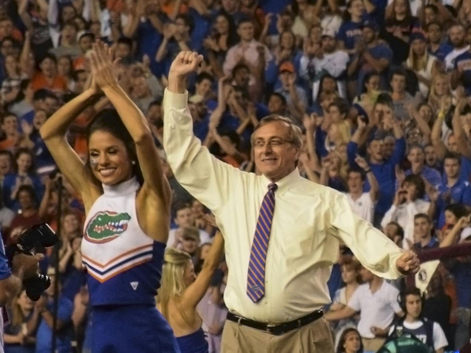 UF President Kent Fuchs leads a crowd of more than 90,000 people in a cheer as honorary Mr. Two Bits before the Florida State University game on Nov. 28, 2015, in Ben Hill Griffin Stadium. “It was incredible,” he said afterwards, about leading the cheer.