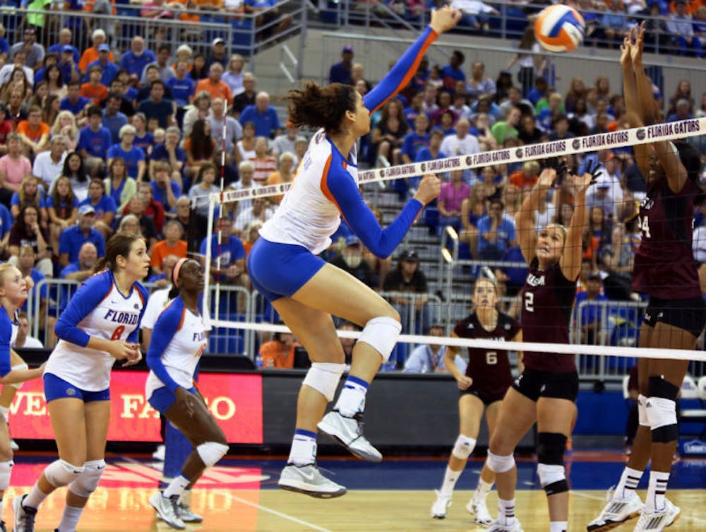 <p>Alex Holston blocks the ball during Florida’s three-set win against Texas A&amp;M on Oct. 4 in the O’Connell Center.</p>