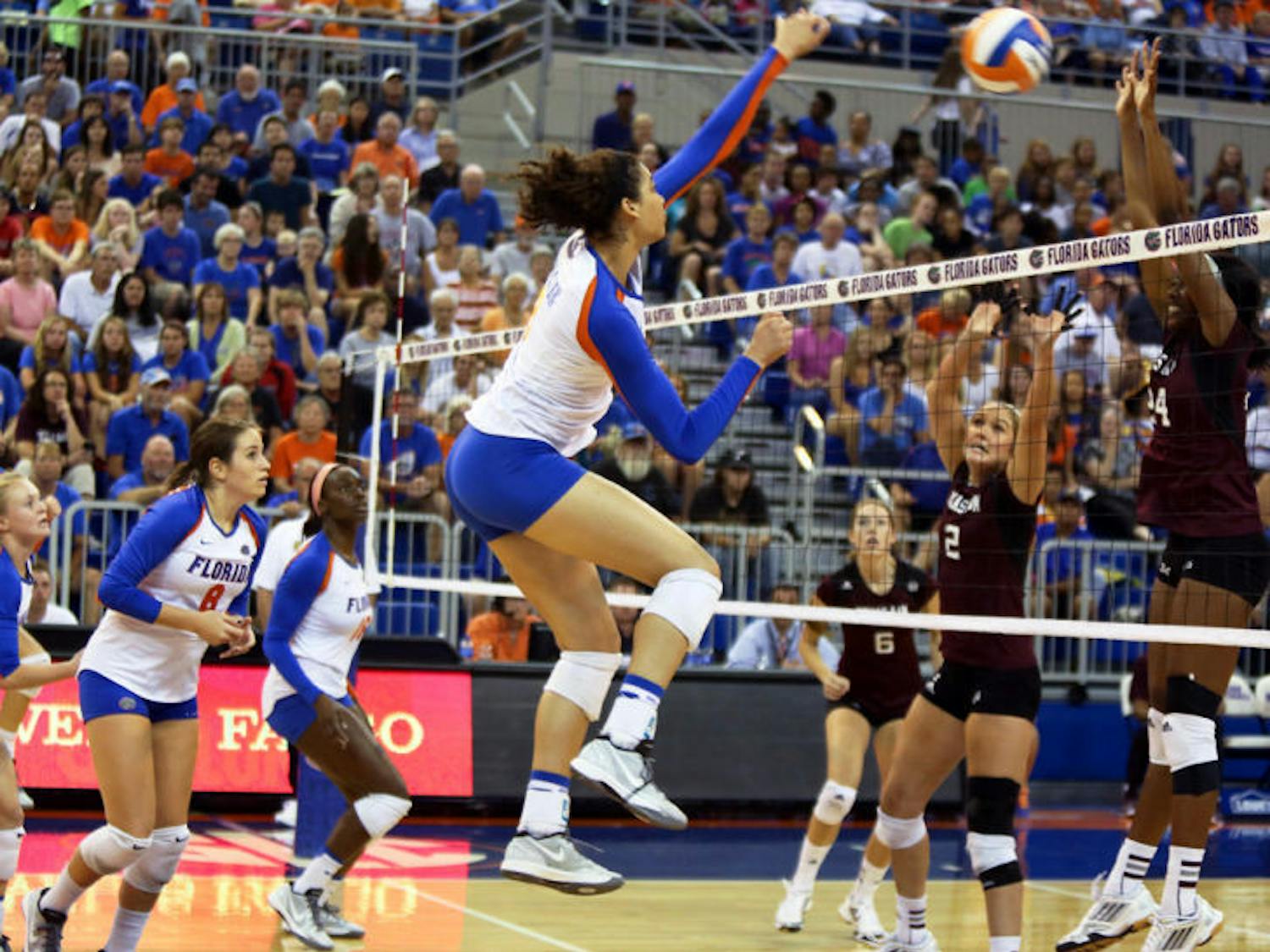 Alex Holston blocks the ball during Florida’s three-set win against Texas A&amp;M on Oct. 4 in the O’Connell Center.