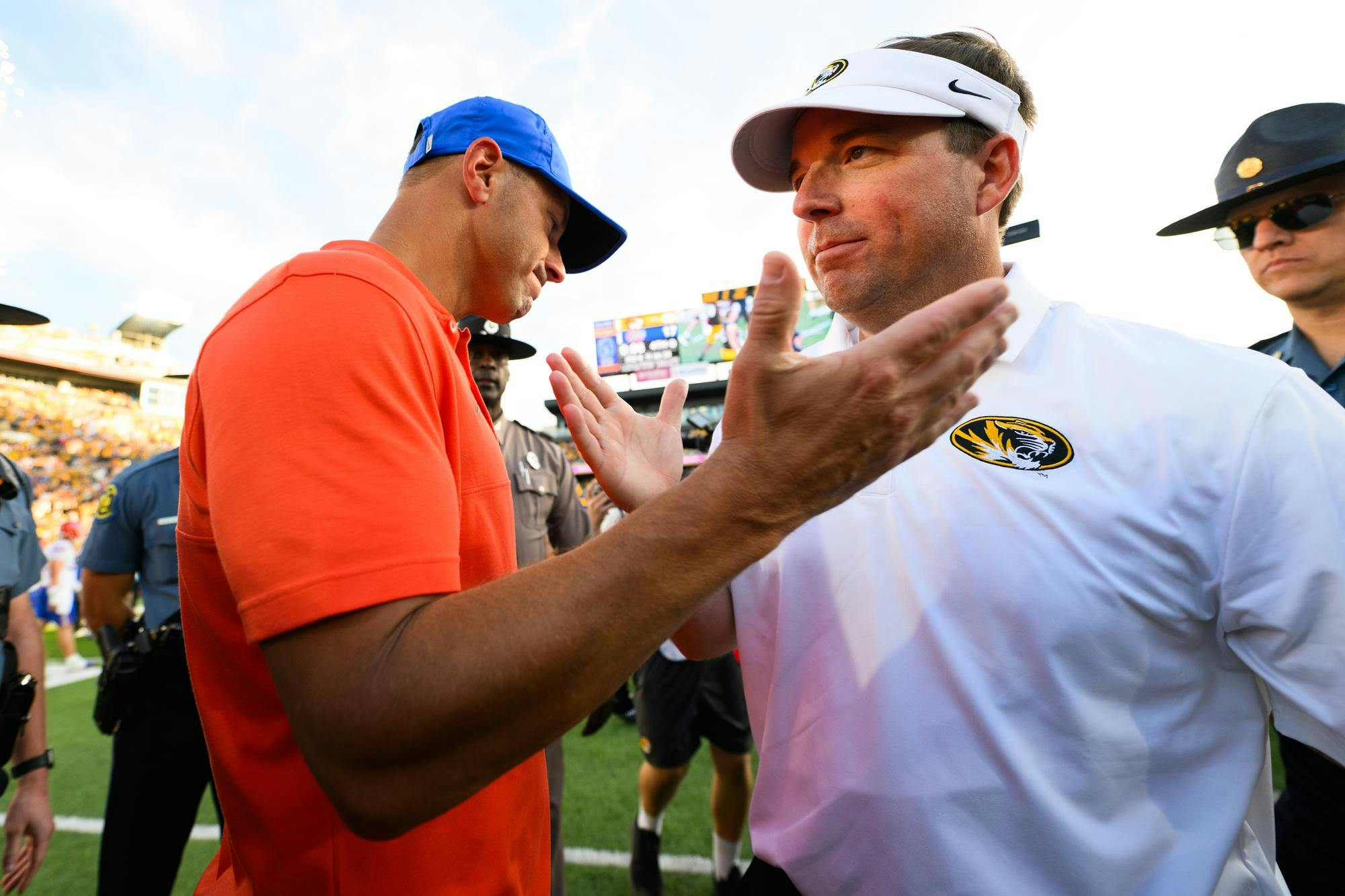 Florida head coach Jon Sumrall shakes hands with Missouri head coach Eli Drinkwitz after losing an NCAA college football game, Saturday, Oct. 3, 2026, in Columbia, Mo.