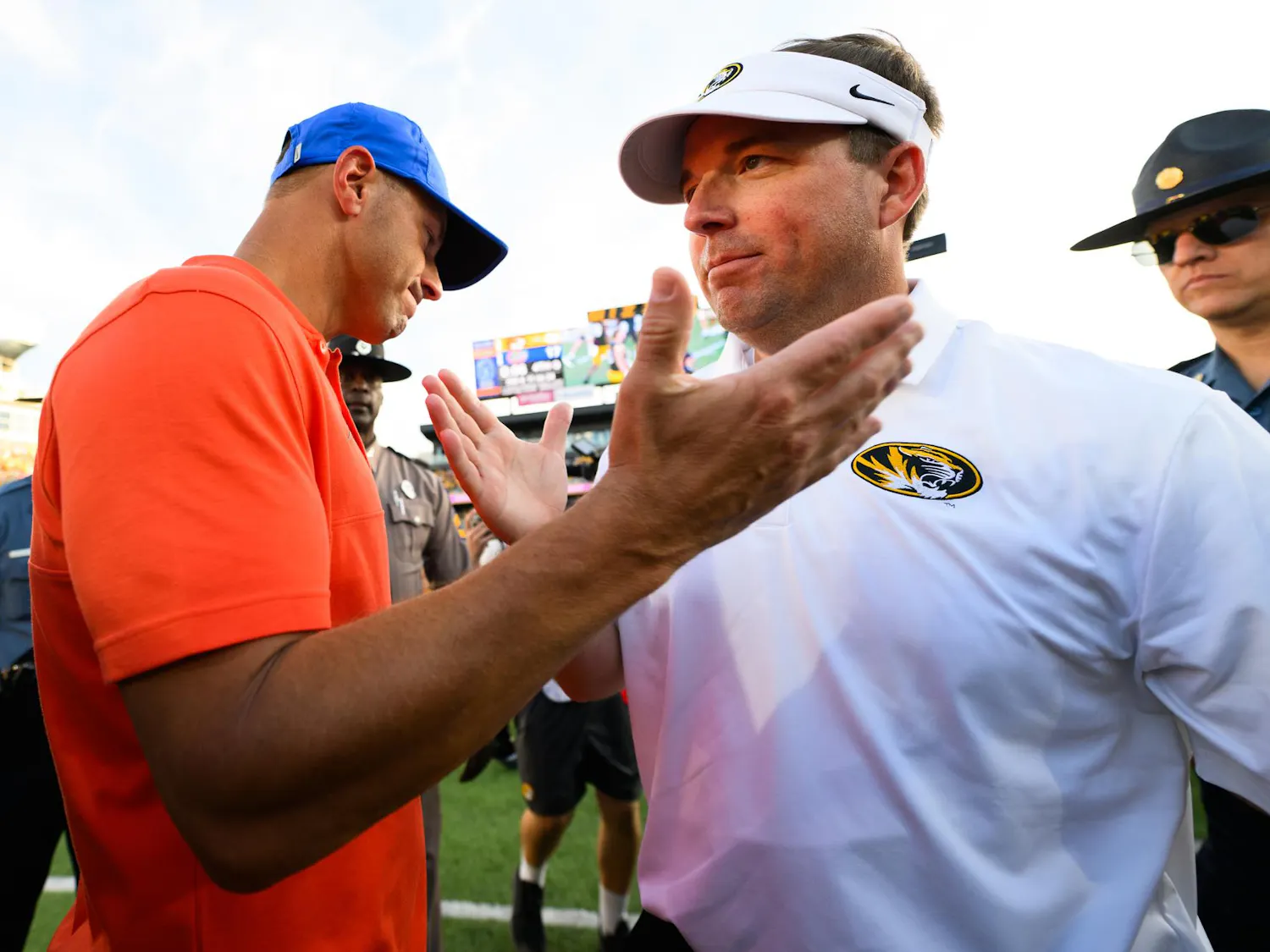 Florida head coach Jon Sumrall shakes hands with Missouri head coach Eli Drinkwitz after losing an NCAA college football game, Saturday, Oct. 3, 2026, in Columbia, Mo.