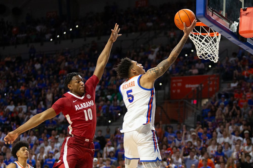 Gators men's basketball junior guard Will Richard soars for a layup in the team's 105-87 win over the Alabama Crimson Tide on Tuesday, March 5, 2024.