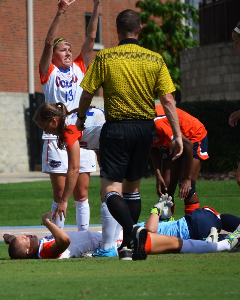 Pamela Begic lies on the ground during Florida’s 3-0 victory against Auburn on Sunday at James G. Pressly Stadium.