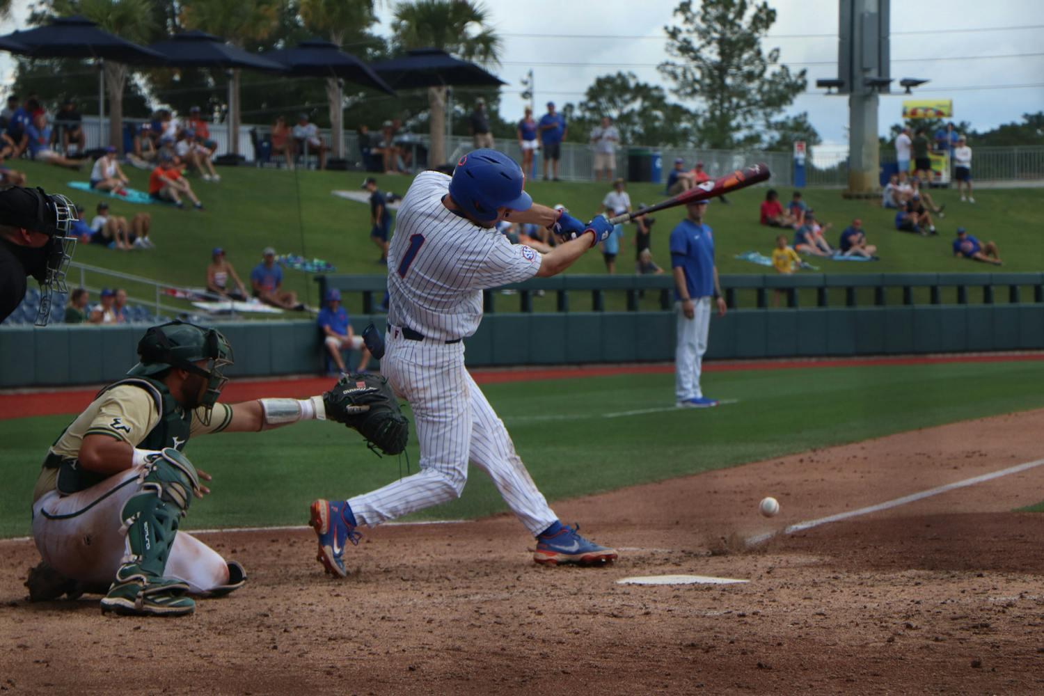 Jacob Young swings against USF. The Gators lost to the Bulls 5-3 Friday.