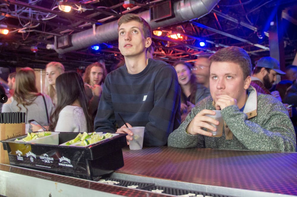 Grant Howard, a 21-year-old UF statistics junior, and Thomas DePaola, a 21-year-old UF applied physiology and kinesiology junior, drink at Fat Daddy’s Tuesday night during the pub crawl for Wyatt Fulghum. Although neither student knows Fulghum personally, they were happy that they could contribute to the treatment for Fulghum’s stage four brain cancer. “It’s a great reason to go out,” Howard said. 