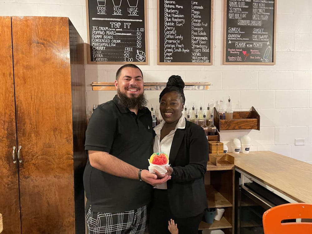 Cody Sheppard and Kassandra Rodriguez pose in their store, Charlie’s Snow Shack, on Feb. 3, 2025. 