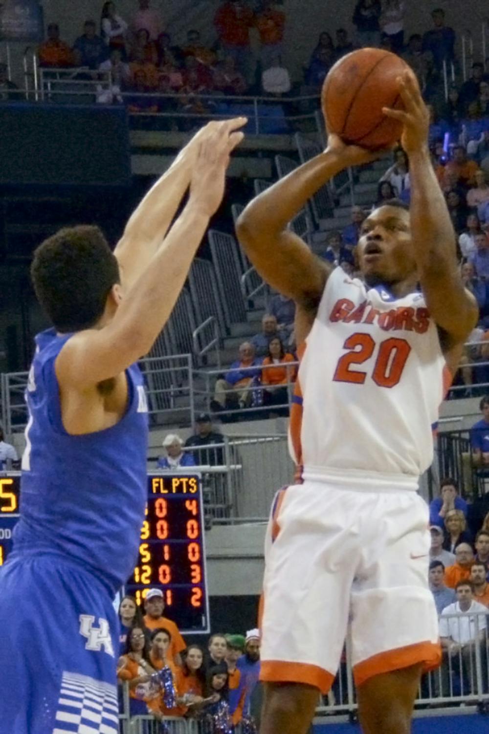 <p>Michael Frazier attempts a three-point shot during Florida's loss to No. 1 Kentucky in the O'Connell Center.</p>