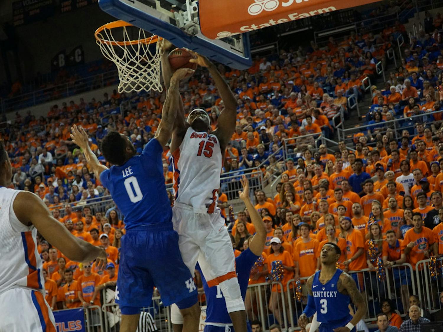 UF center John Egbunu goes for a layup over Kentucky's Marcus Lee during Florida's 88-79 loss on March 1, 2016, in the O'Connell Center.