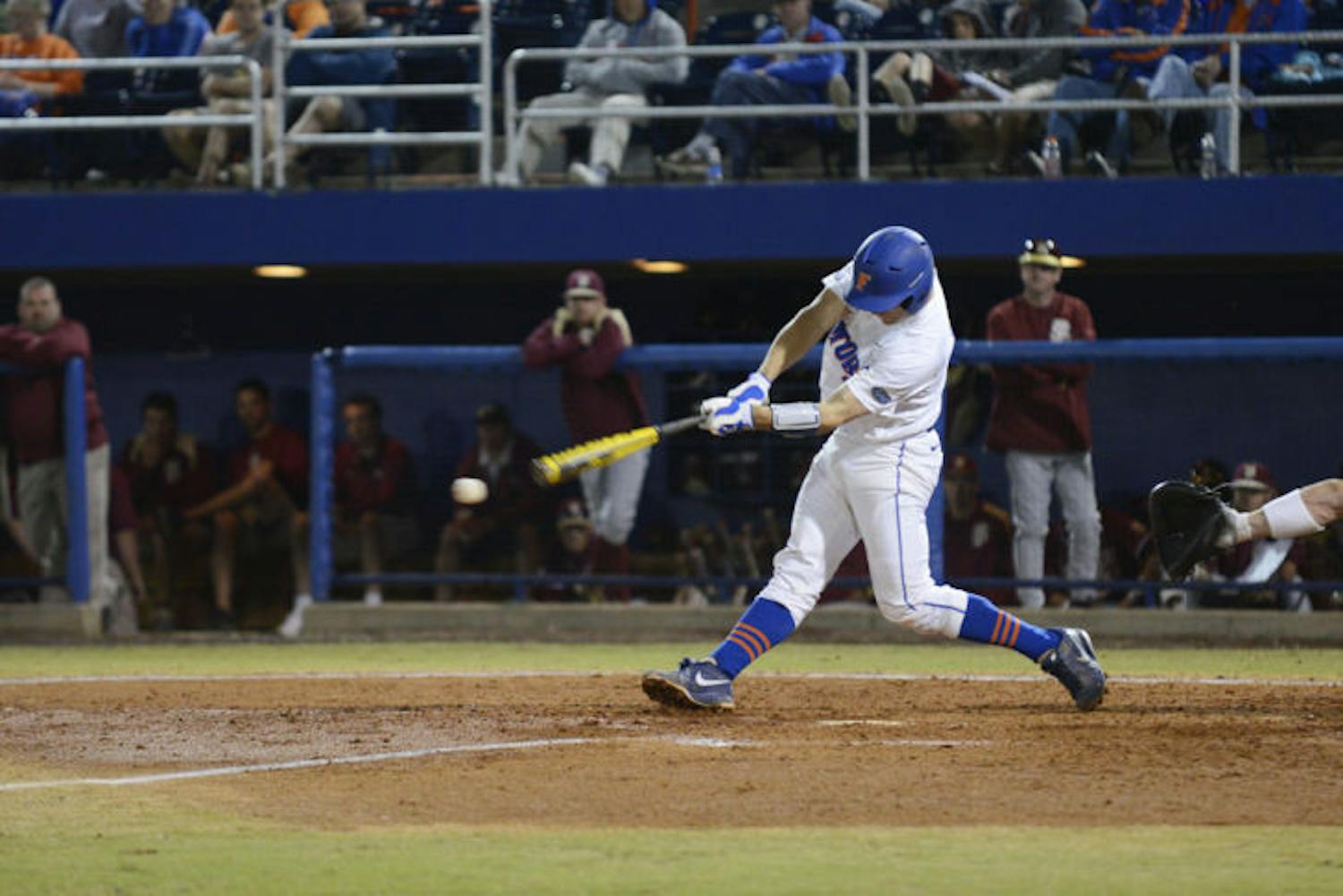 Catcher Taylor Gushue swings during Florida’s 4-1 loss to Florida State on March 12, 2013 at McKethan Stadium. Gushue had a career high four hits, three singles and a double, on Friday against Miami.