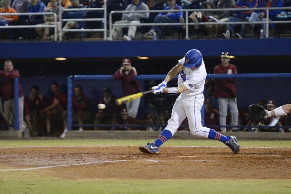 <p class="p1">Catcher Taylor Gushue swings during Florida’s 4-1 loss to Florida State on March 12, 2013 at McKethan Stadium. Gushue had a career high four hits, three singles and a double, on Friday against Miami.</p>