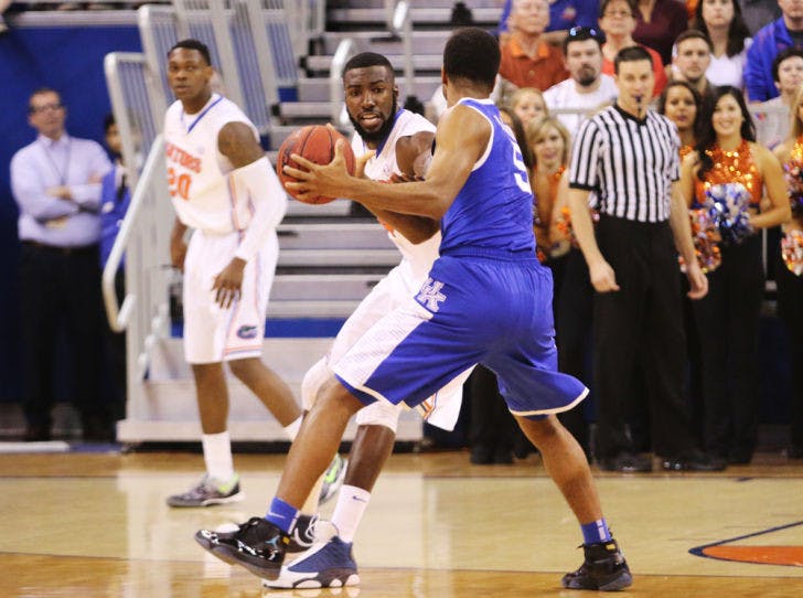 Patric Young defends during Florida’s 84-65 victory against Kentucky on Saturday in the O’Connell Center. Young and UF start Southeastern Confererence Tournament play against Mizzou today at 1 p.m.