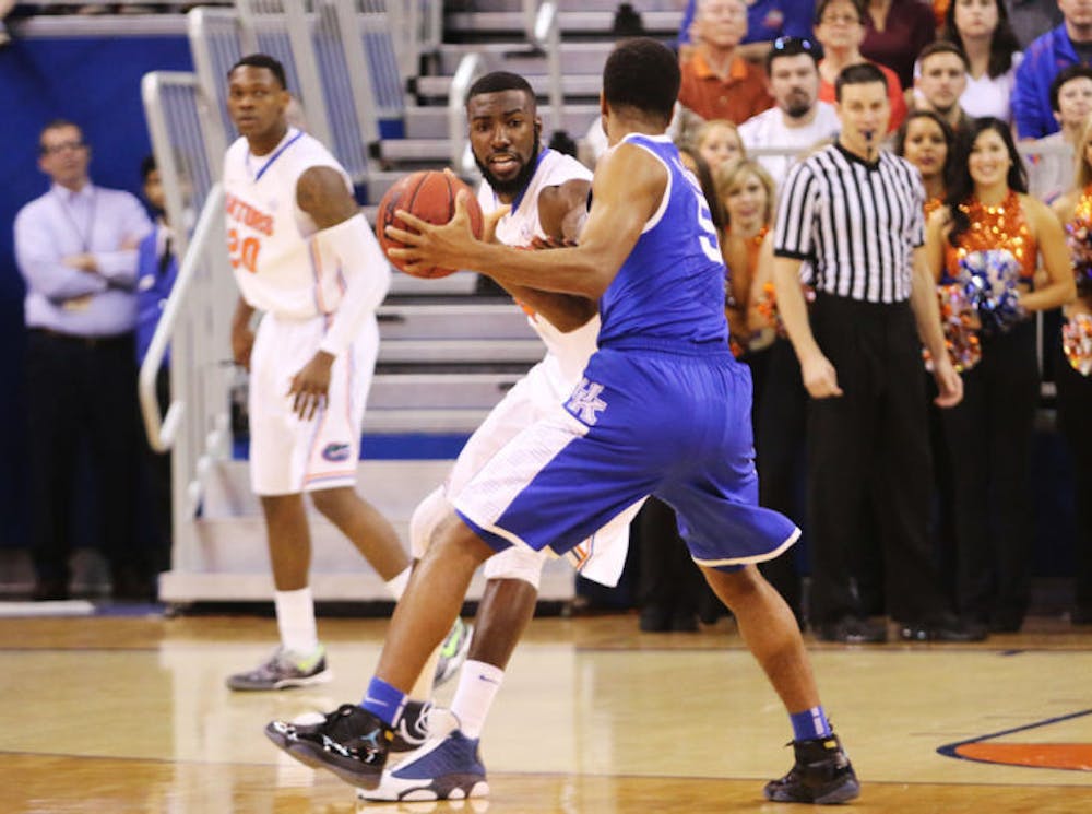 <p align="justify">Patric Young defends during Florida’s 84-65 victory against Kentucky on Saturday in the O’Connell Center. Young and UF start Southeastern Confererence Tournament play against Mizzou today at 1 p.m.</p>