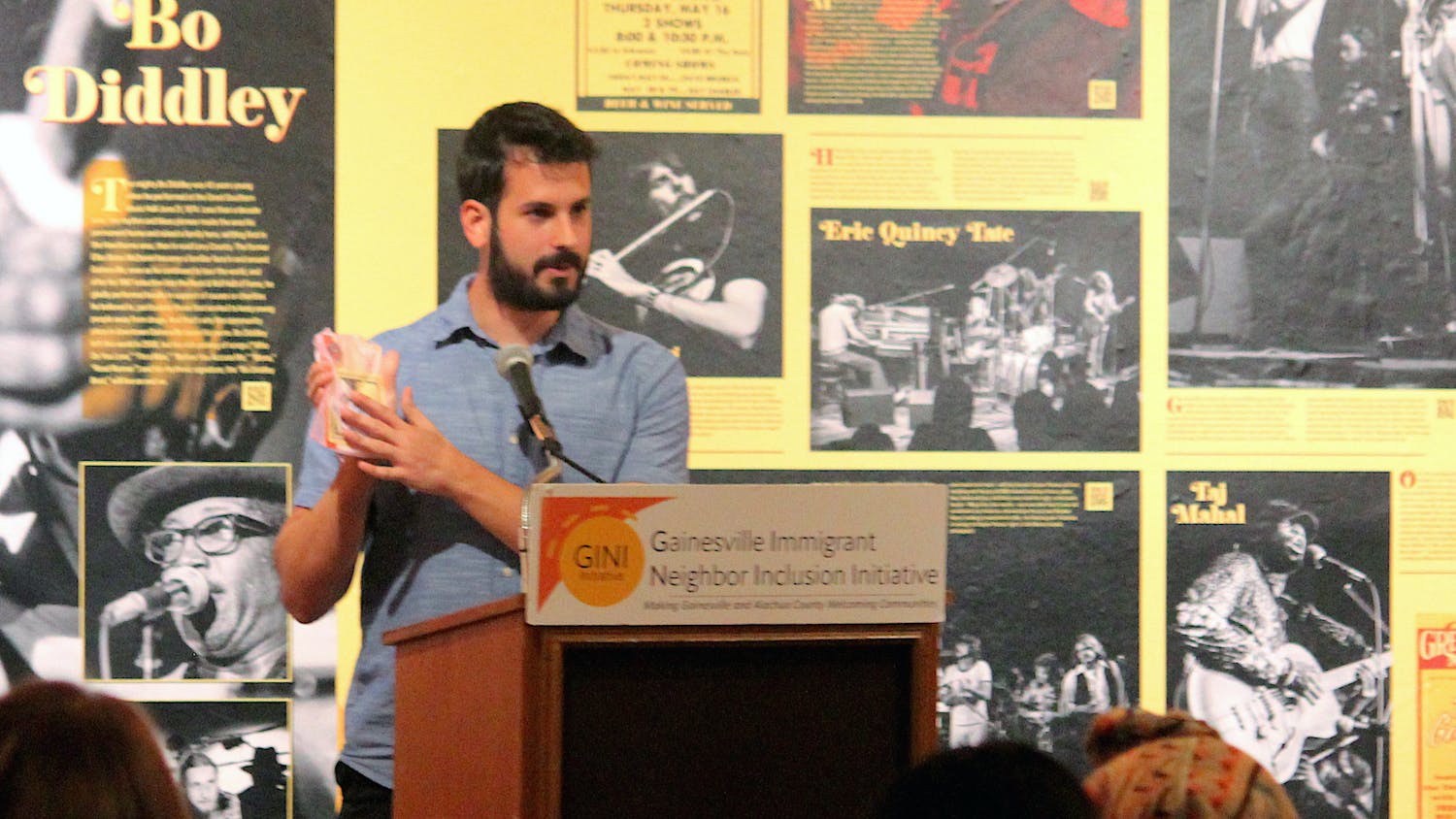 Board member of the Gainesville Immigrant Neighbor Inclusion Initiative Ethan Maia de Needell speaks at the GINI Anniversary celebration at the Matheson History Museum on Friday, Sept. 8, 2023. Ethan Maia de Needell, miembro de la junta de Inclusión de Vecinos Inmigrantes de Gainesville [Gainesville Immigrant Neighbor Inclusion], habla en la celebración del aniversario de GINI en el Museo de Historia de Matheson el viernes 8 de septiembre de 2023.