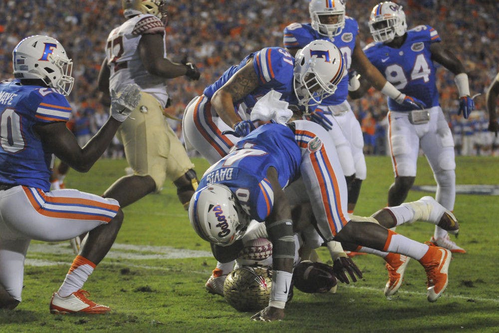 UF linebacker Jarrad Davis tackles Florida State running back Dalvin Cook during Florida's 27-2 loss on Nov. 28, 2015, at Ben Hill Griffin Stadium.