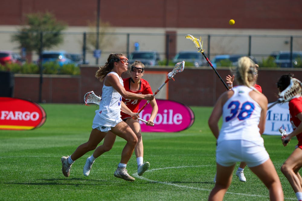 Florida midfielder Emily Heller throws the ball with her crosse during the Gators' 14-13 loss to the Maryland Terrapins Saturday, Feb. 25, 2023.