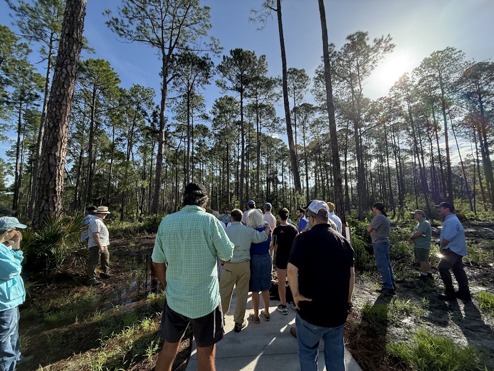 People attend the Black Lake Preserve Ribbon Cutting, Friday, August 21, 2026, in Melrose, Fla.