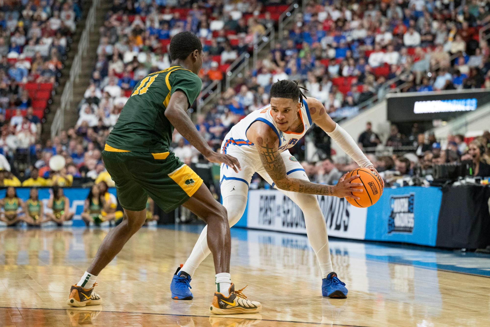 Florida Gators guard Will Richard (5) holds the ball during a basketball game against Norfolk State in the first round of the NCAA Tournament on Friday, March 21, 2025, in Raleigh, N.C.