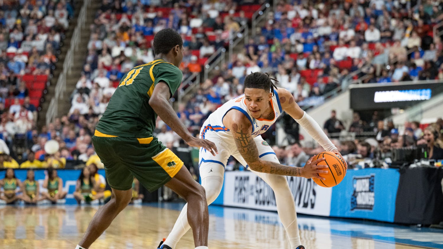 Florida Gators guard Will Richard (5) holds the ball during a basketball game against Norfolk State in the first round of the NCAA Tournament on Friday, March 21, 2025, in Raleigh, N.C.