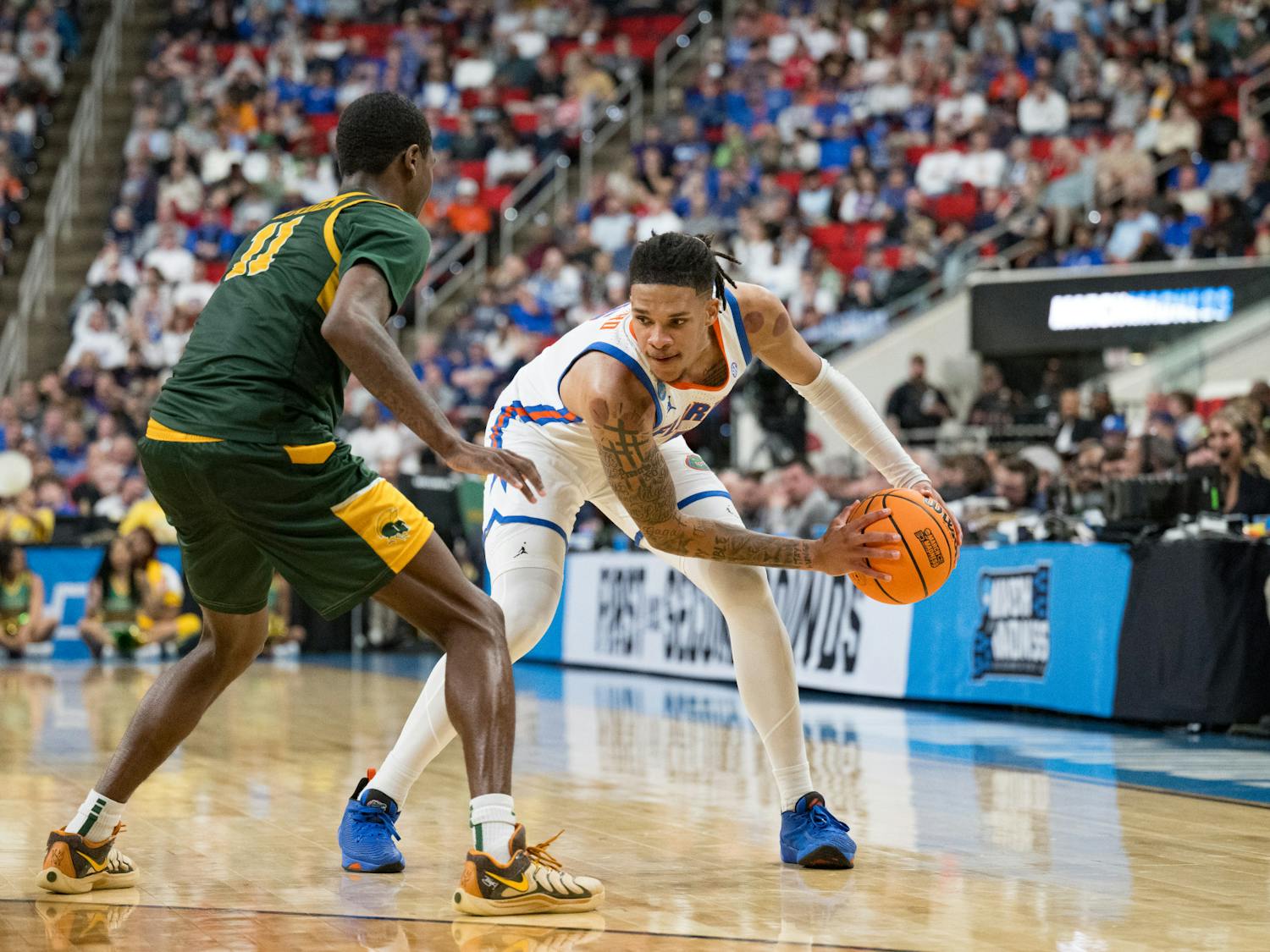 Florida Gators guard Will Richard (5) holds the ball during a basketball game against Norfolk State in the first round of the NCAA Tournament on Friday, March 21, 2025, in Raleigh, N.C.