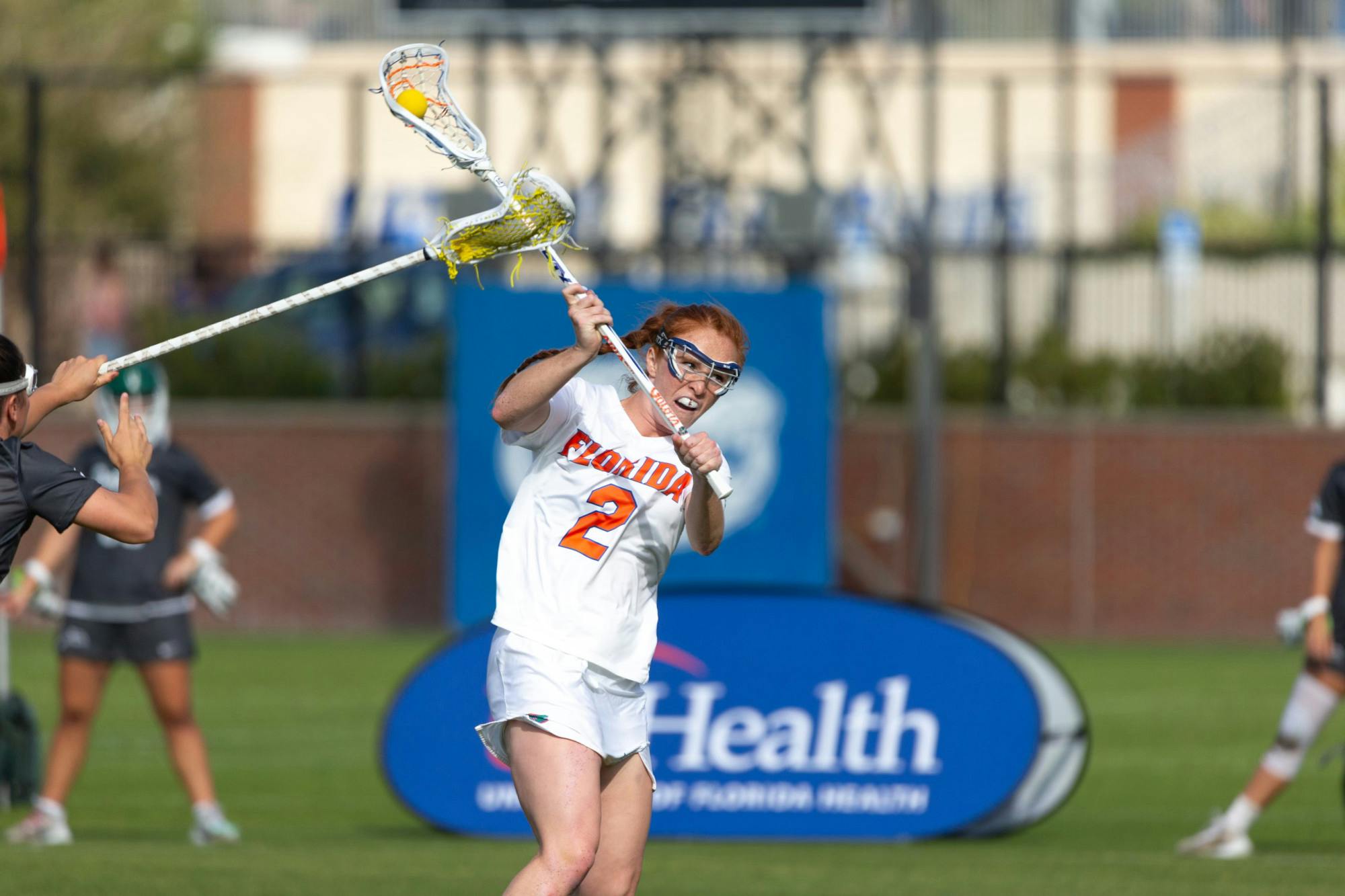 Senior midfielder Madison Waters goes to pass the ball in the Florida lacrosse team's 21-4 win over Jacksonville University on Wednesday, February 28, 2024. 