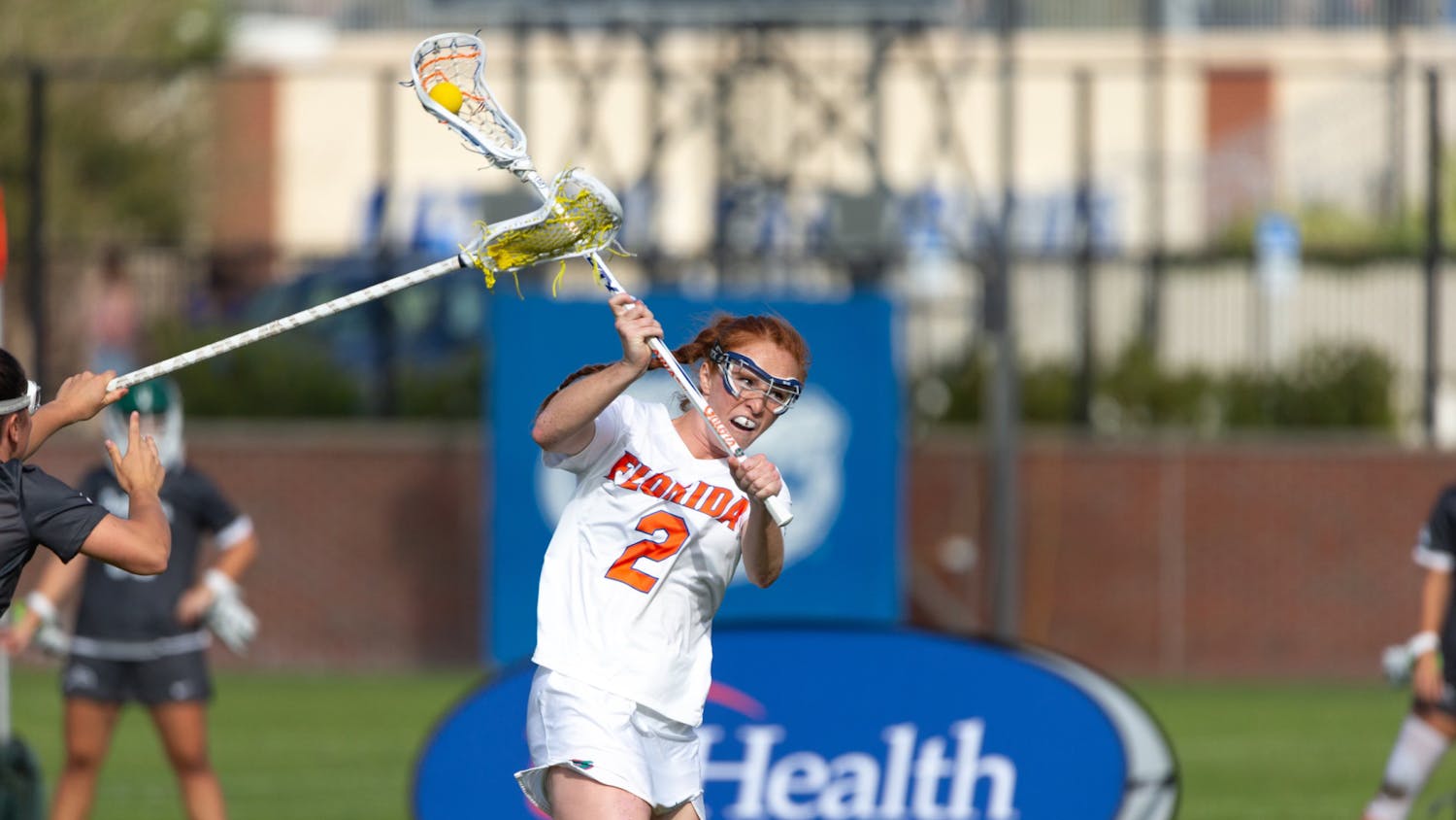 Senior midfielder Madison Waters goes to pass the ball in the Florida lacrosse team's 21-4 win over Jacksonville University on Wednesday, February 28, 2024. 