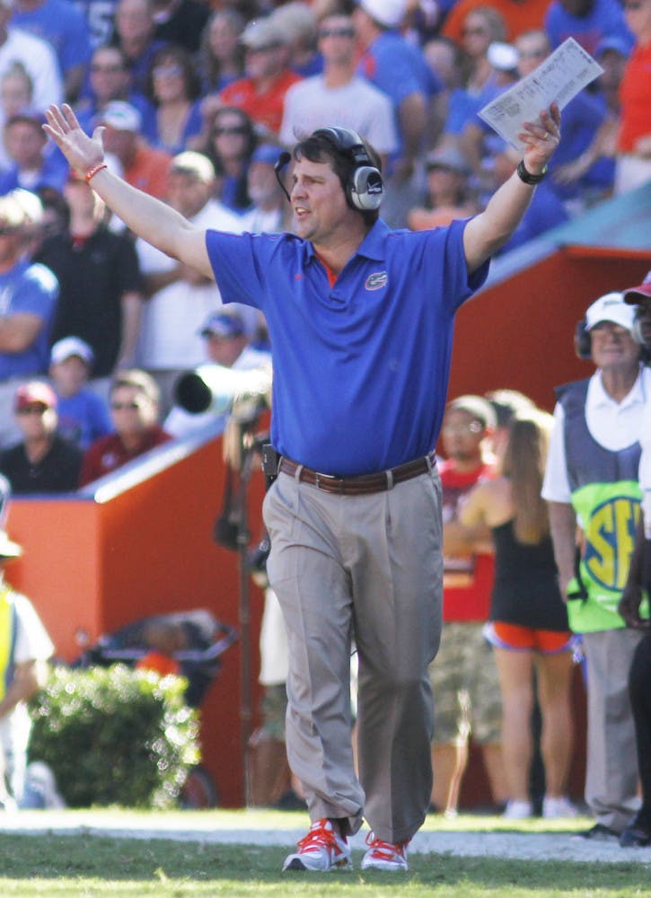 Coach Will Muschamp reacts to a call during UF’s 44-11 win against South Carolina on Saturday in The Swamp.
