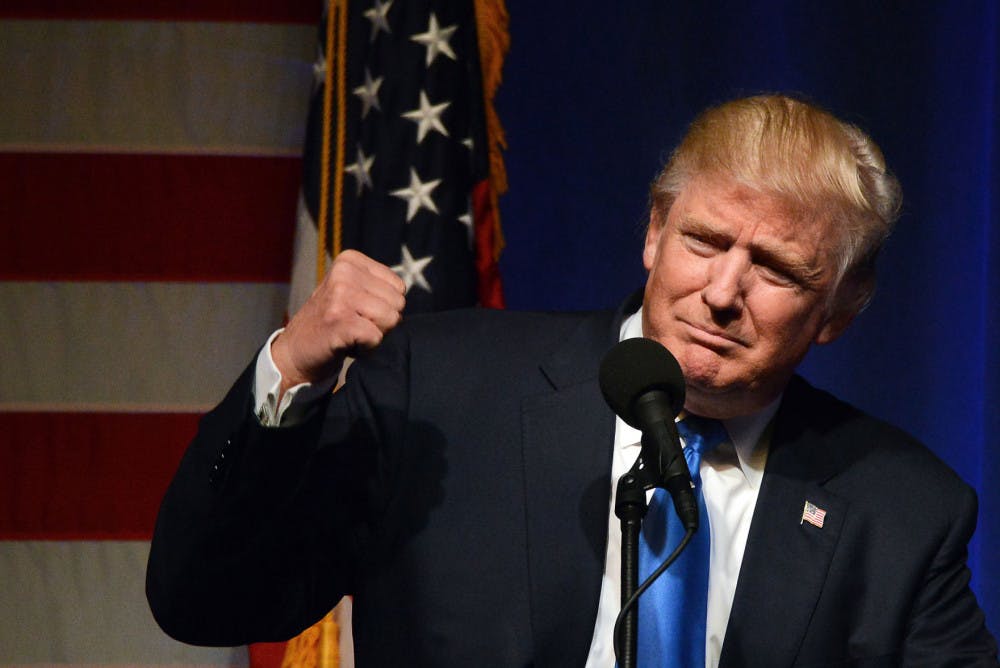 Republican presidential candidate Donald Trump pumps his fist during a campaign rally at the Lackawanna College Student Union in downtown Scranton, Pa., Monday, Nov. 7, 2016. (Butch Comegys/The Times &amp; Tribune via AP)