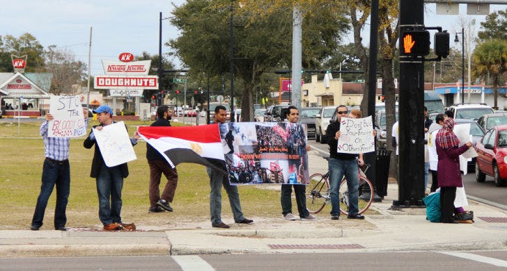 The Egyptian Student Association of UF protests on University Avenue Saturday afternoon to raise awareness for oppression in Egypt. &nbsp;&nbsp;