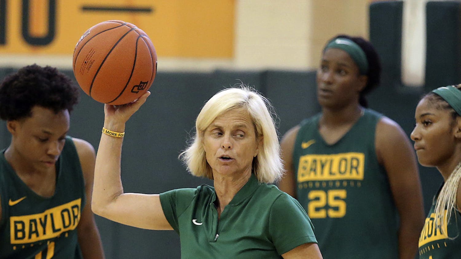 FILE - In this Sept. 30, 2019, file photo, Baylor women's coach Kim Mulkey, center, talks with players during the NCAA college basketball team's practice in Waco, Texas. The NCAA Division I Council on Wednesday, June 17, 2020, approved a plan to allow college basketball players to start working with their coaches for the first time since the pandemic wiped out March Madness. The summer access period for men's and women's players will begin July 20. (Jerry Larson/Waco Tribune-Herald via AP, File)
