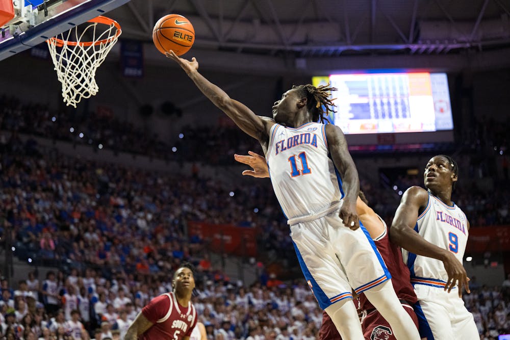 Florida Gators guard Denzel Aberdeen (11) goes for a layup in a basketball game against South Carolina on Saturday, Feb. 15, 2025, in Gainesville, Fla.