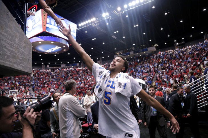 UCLA’s Kyle&nbsp;Anderson (5) touches hands with a fan after defeating Stephen F. Austin 77-60 in a third-round game of the NCAA Tournament on Sunday night in San Diego.