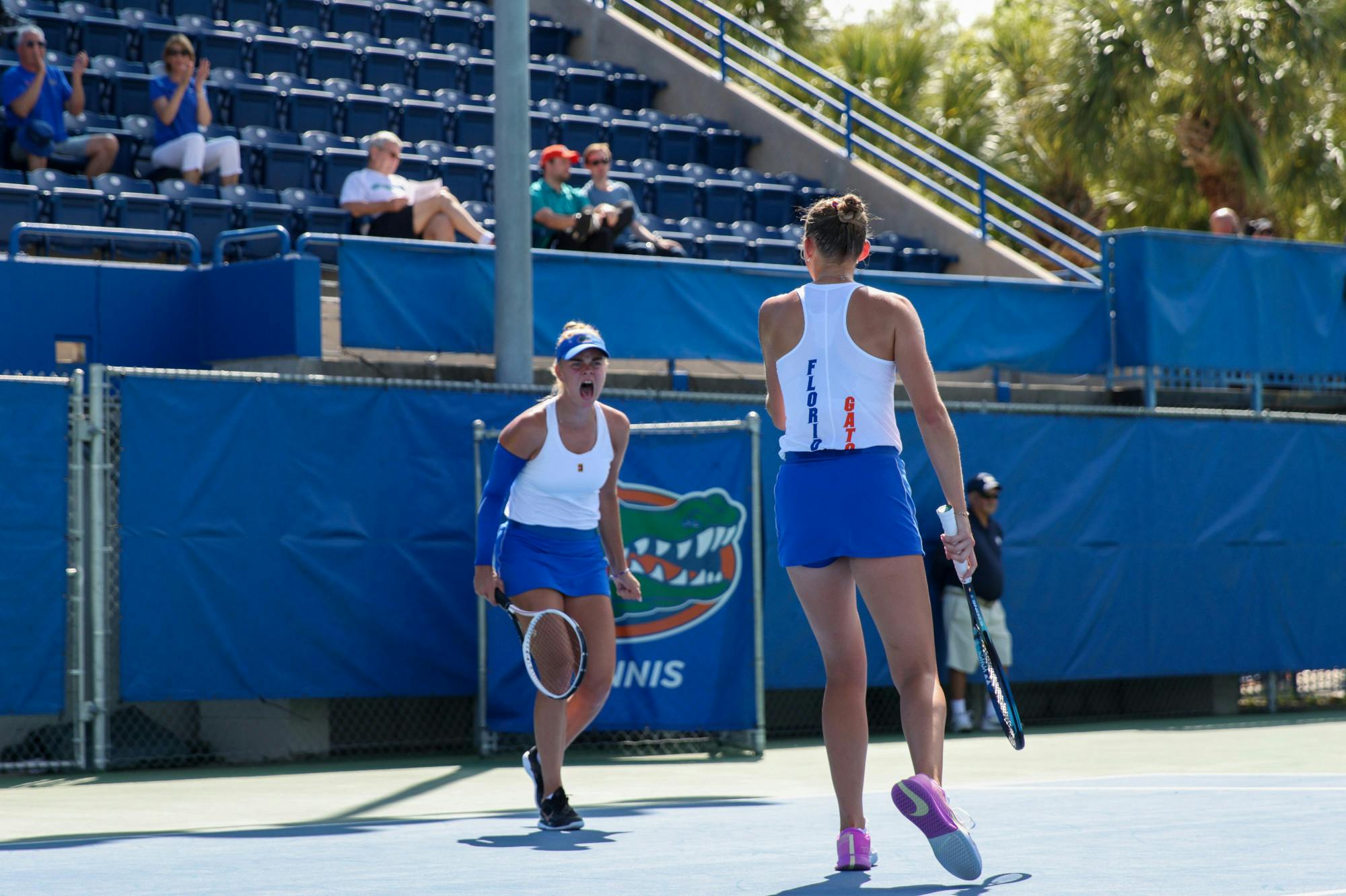Florida sophomores Bente Spee and Alicia Dudeney celebrate during their doubles match in the Gators' win against the No. 3 Michigan Wolverines Wednesday, March 22, 2023. 