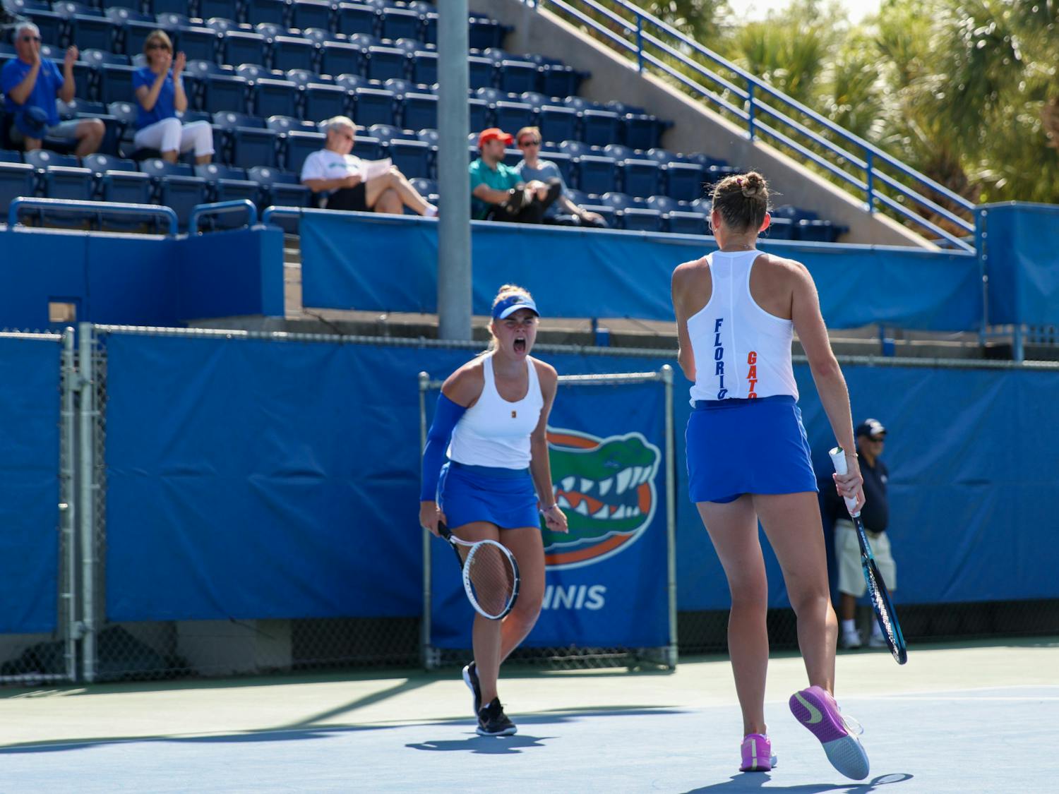 Florida sophomores Bente Spee and Alicia Dudeney celebrate during their doubles match in the Gators' win against the No. 3 Michigan Wolverines Wednesday, March 22, 2023. 
