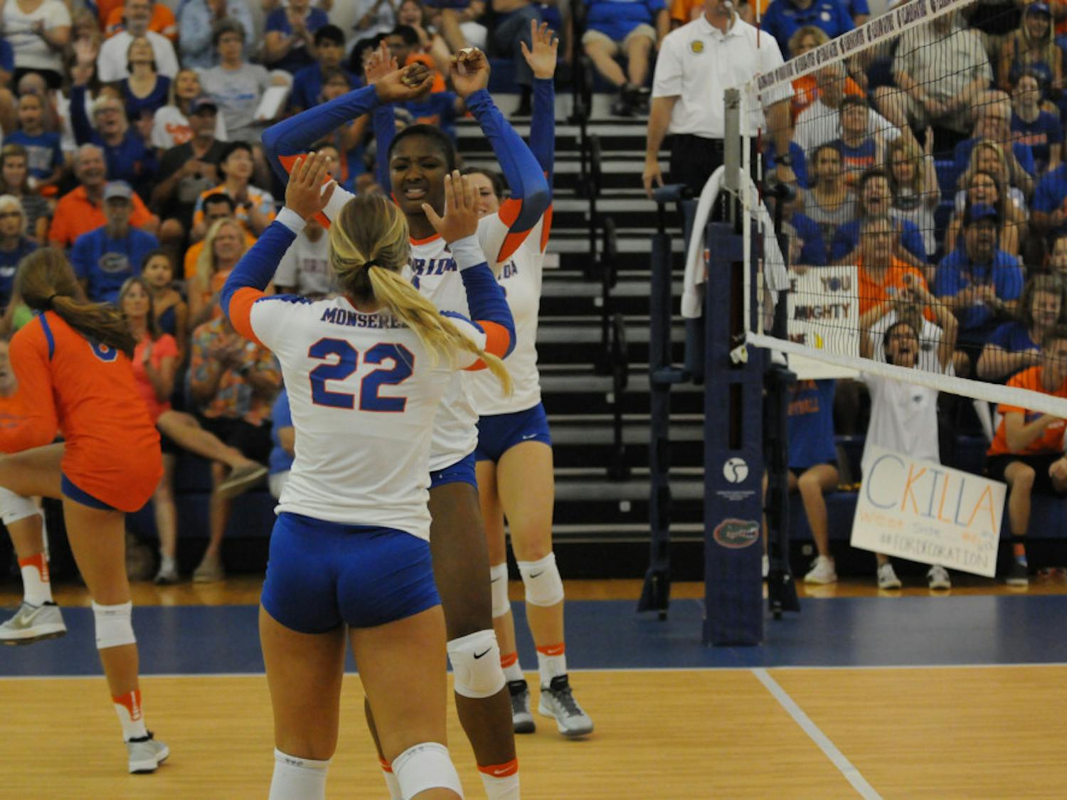 Allie Monserez (22) celebrates with teammate Rhamat Alhassan during Florida's Sept. 17, 2016, win over Marshall in the Lemerand Center. 