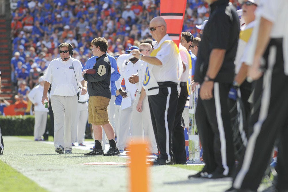 UF coach Jim McElwain walks on the sideline during Florida's 9-7 win against Vanderbilt on Nov. 7, 2015, at Ben Hill Griffin Stadium.