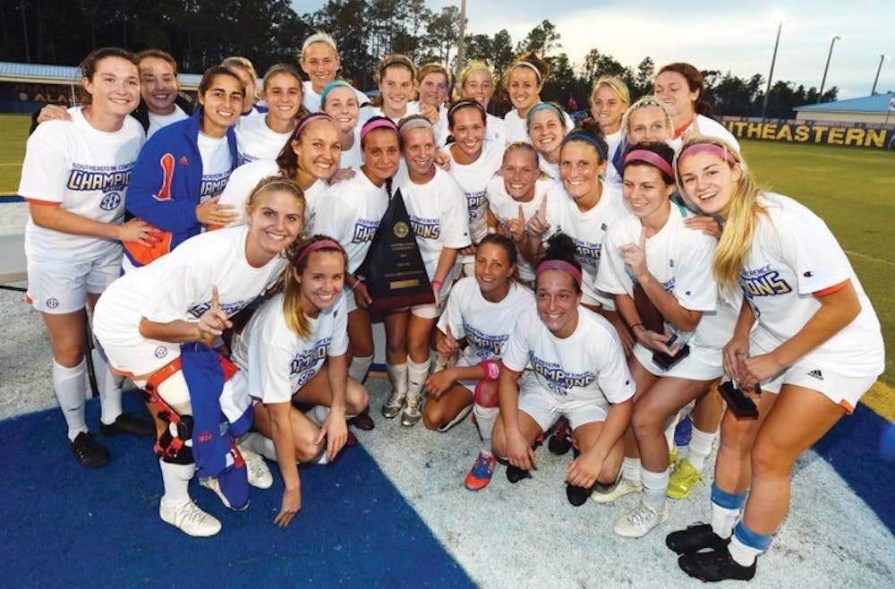 <p>Florida’s women’s soccer team celebrates after winning the SEC Tournament with a 3-0 victory in the final against Auburn on Sunday at the Orange Beach Sportsplex in Orange Beach, Ala.</p>