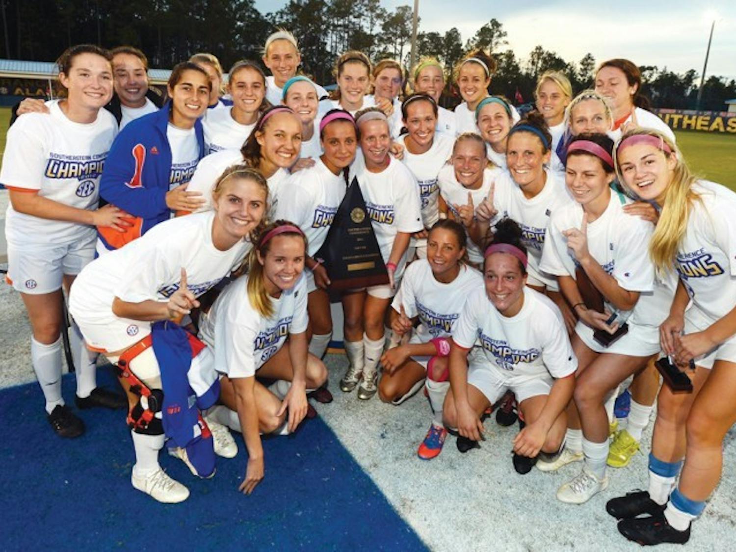 Florida’s women’s soccer team celebrates after winning the SEC Tournament with a 3-0 victory in the final against Auburn on Sunday at the Orange Beach Sportsplex in Orange Beach, Ala.