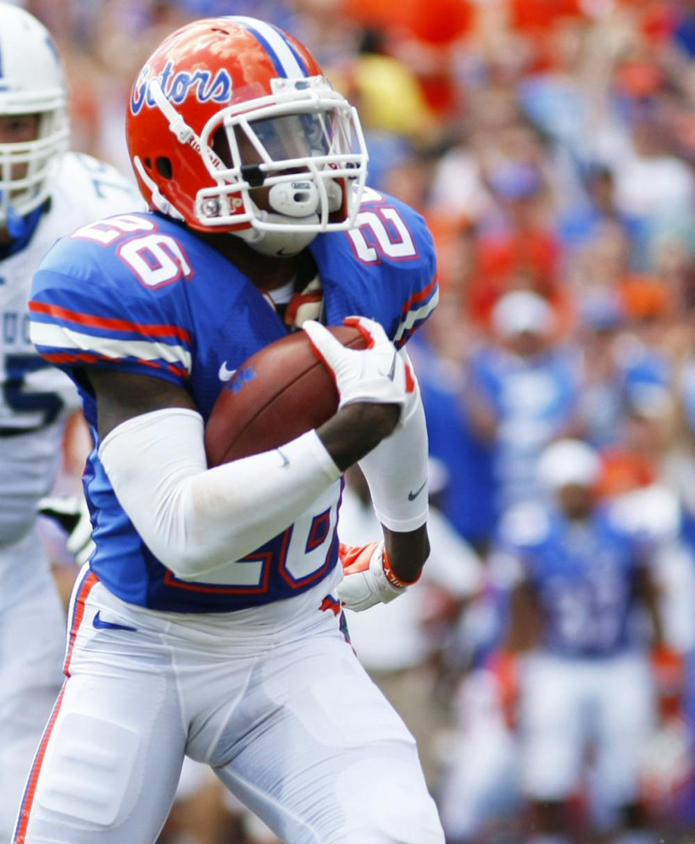 <p>Sophomore defensive back De'Ante Saunders returns a interception during Florida's 38-0 win against Kentucky at Ben Hill Griffin Stadium on Sept. 22. </p>