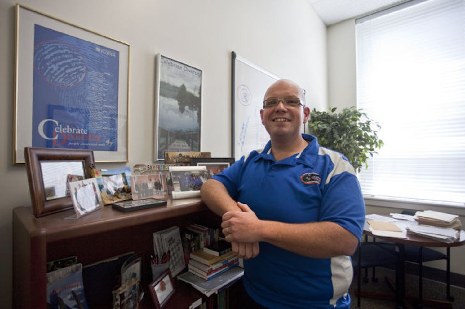 Jarrod Cruz-Stipsits, director of intercultural engagement for UF Multicultural &amp; Diversity Affairs, poses in his current office in Peabody Hall on Wednesday afternoon.
&nbsp;