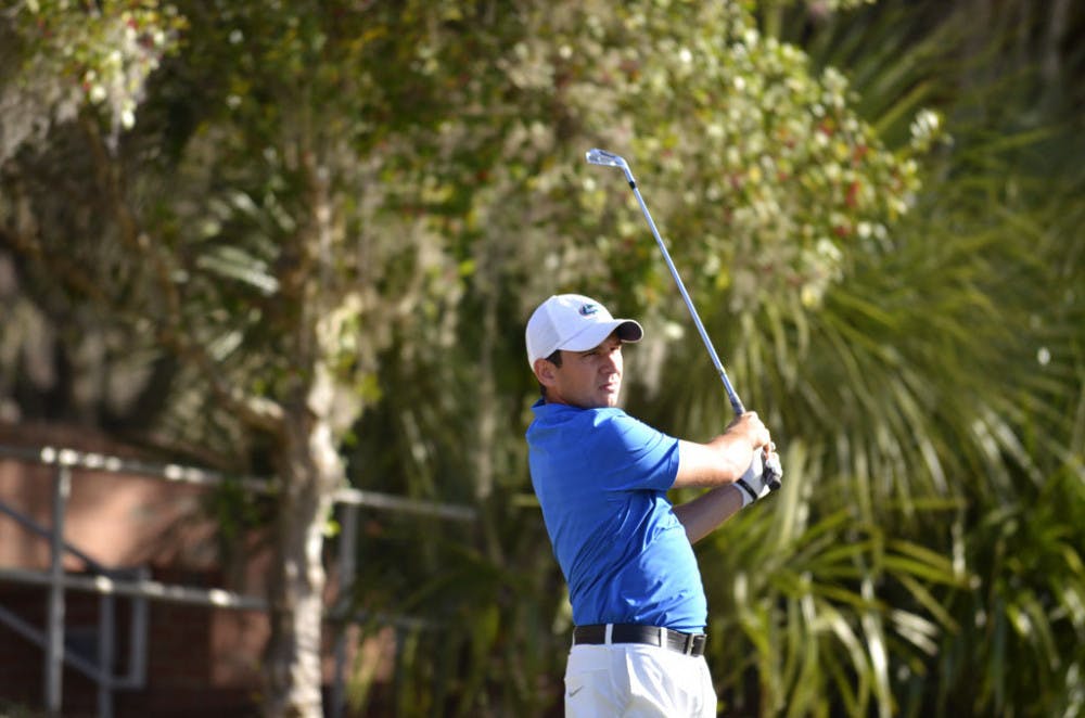 Alejandro Tosti follows through on a swing at the 2016 SunTrust Gator Invitational at the Mark Bostick Golf Course.