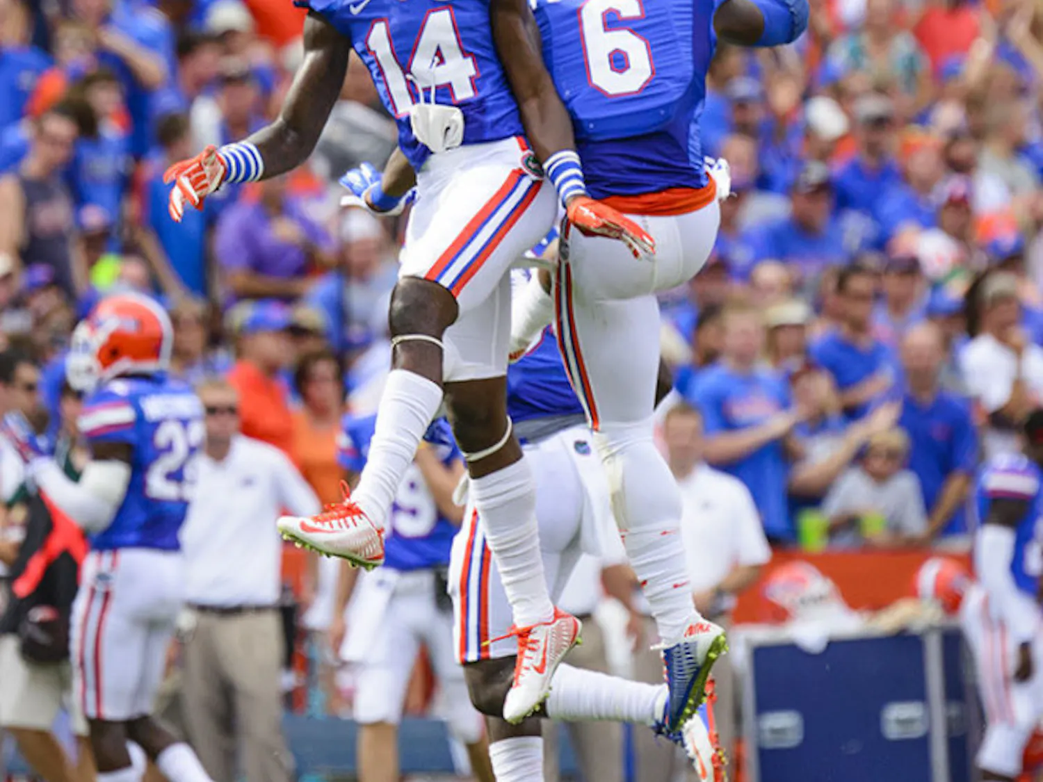 Alex McCalister and Dante Fowler Jr. celebrate an Eagles turnover during the Florida's 65-0 win against Eastern Michigan on Saturday at Ben Hill Griffin Stadium.