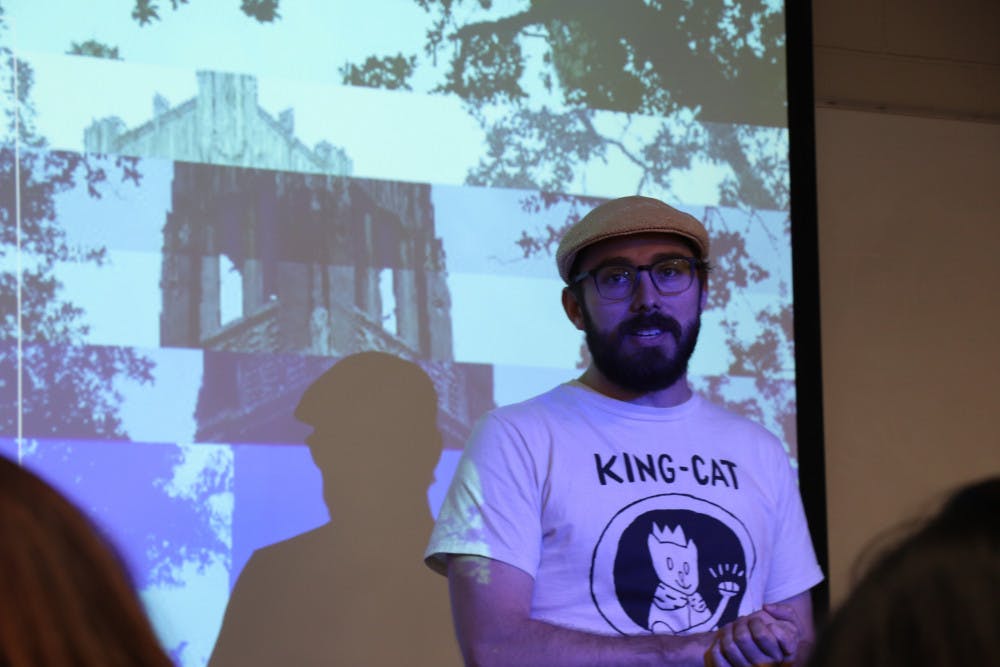 Jeremiah Tattersall, the lead organizer of the Alachua County Labor Coalition, presents the speakers at the first teach-in event held by ACLC at UF. 