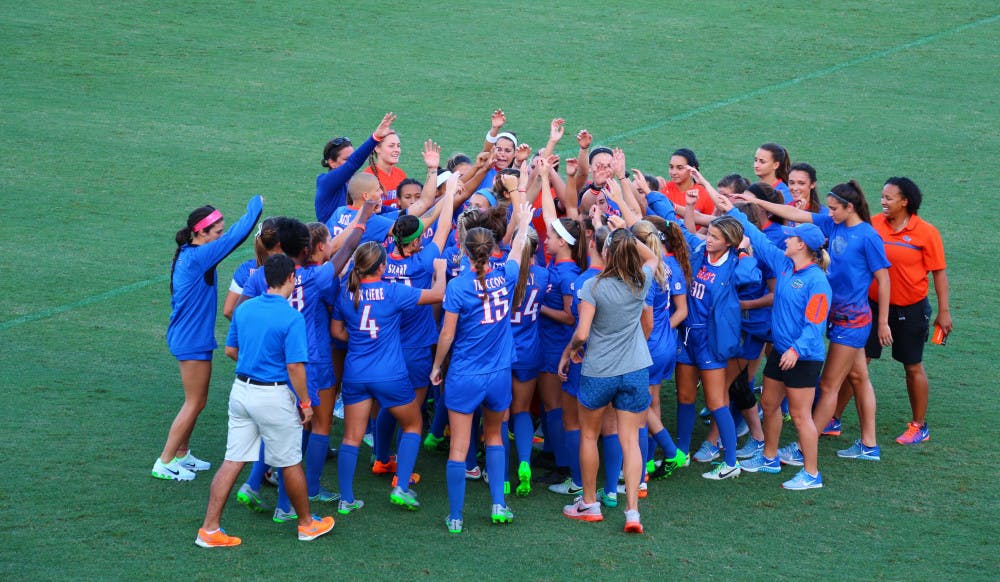 The Florida soccer team huddles during its 6-0 win over Alabama on Oct. 20 at Donald R. Dizney Stadium