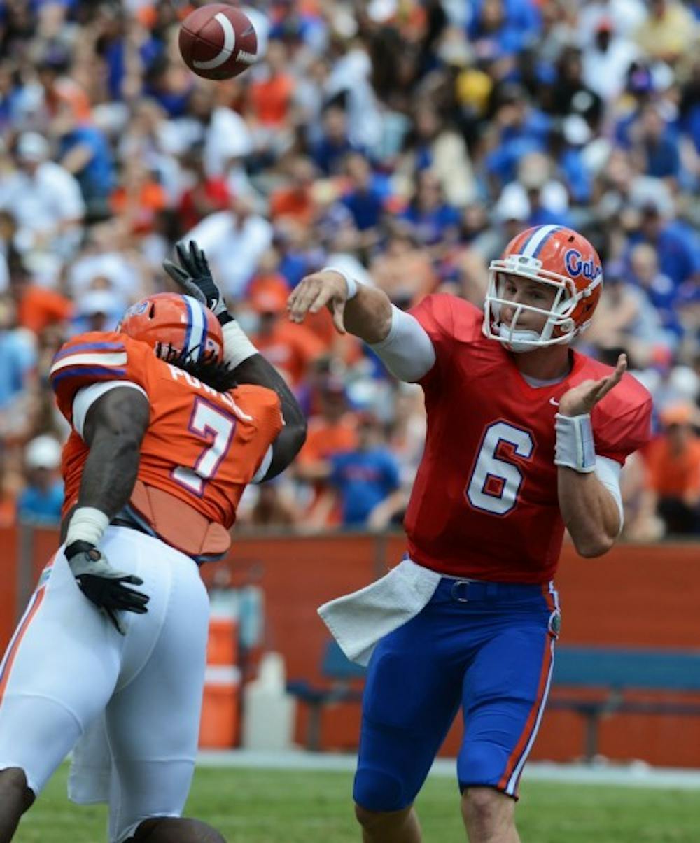 <p>Sophomore quarterback Jeff Driskel attempts a pass during the Orange and Blue Debut April 7. Driskel will start against Texas A&amp;M Saturday in College Station, Tx.</p>