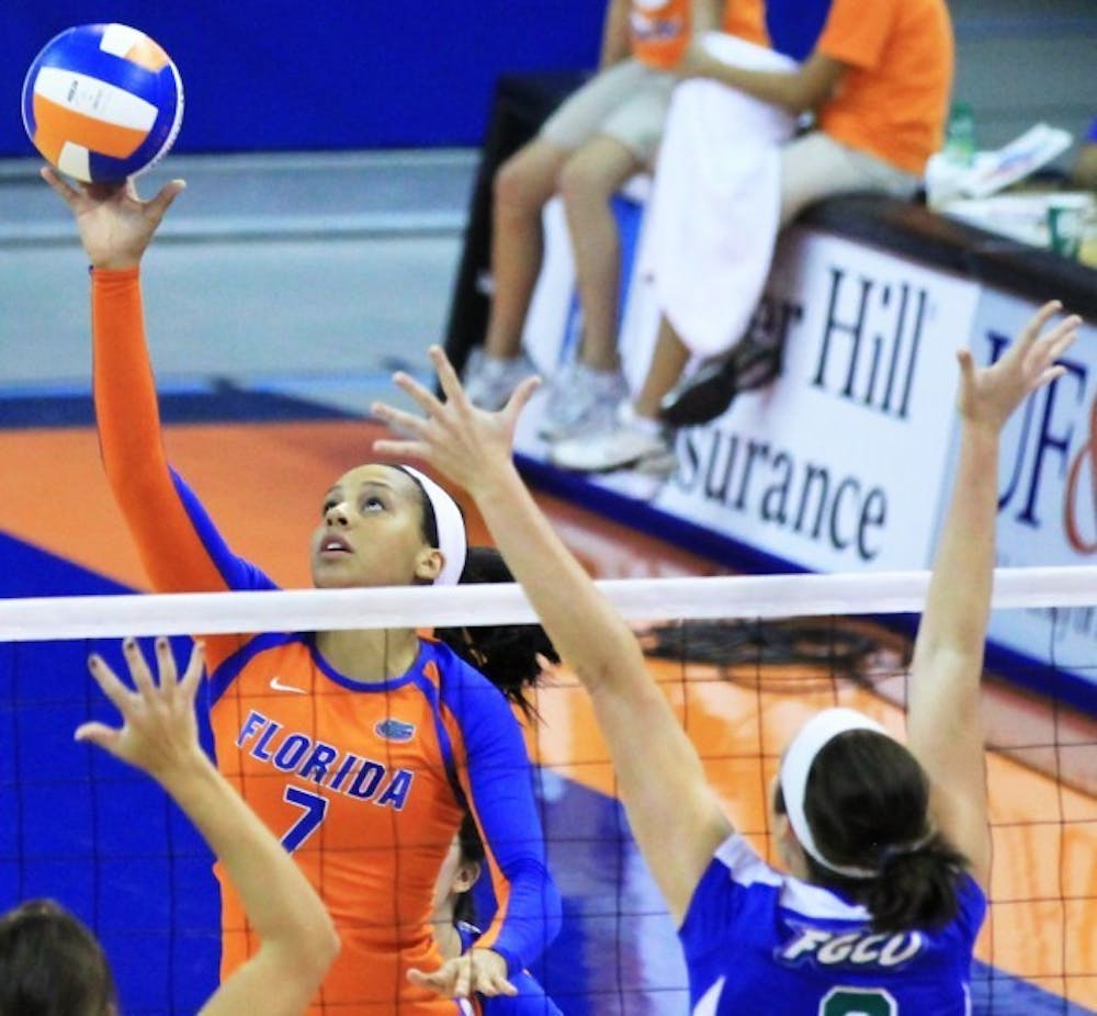 <p>Gabby Mallette tips the ball over the net against Florida Gulf Coast at the Stephen C. O'Connell Center&nbsp;earlier this season. Despite having only one day to prepare for Kentucky, Mallette and fellow freshman Ziva Recek led Florida to a rare win in Lexington, Ky., on Sunday.</p>